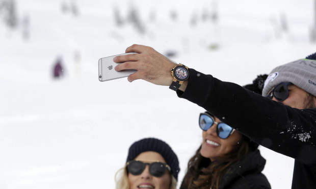 Hikers gather on Mount Rainier (AP Photo/Elaine Thompson)...