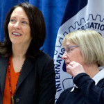 Sen. Patty Murray, D-Wash., right, and Sen. Maria Cantwell, D- Wash., stand together as Democratic presidential candidate Hillary Clinton speaks during a campaign event at the IAM District 751 Everett Union Hall in Everett, Wash., Tuesday, March 22, 2016. (AP Photo/Carolyn Kaster)