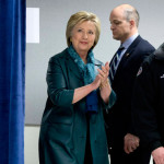 Democratic presidential candidate Hillary Clinton arrives with Union District President Jon Holden, right, for a campaign event at the IAM District 751 Everett Union Hall in Everett, Wash., Tuesday, March 22, 2016. (AP Photo/Carolyn Kaster)