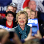 Democratic presidential candidate Hillary Clinton smiles as she takes to the stage during a campaign event at the Boeing Machinists' union hall Tuesday, March 22, 2016, in Everett, Wash. (AP Photo/Elaine Thompson)