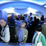 International journalists and other visitors view a mock-up of the interior of the new Boeing 787 airplane Saturday, July 7, 2007, at Boeing's Customer Experience Center in Renton, Wash., the day before Sunday's official roll-out of the first 787 airplane.