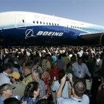The first production model of the new Boeing 787 Dreamliner airplane is unveiled to an audience of several thousand employees, airline executives, and dignitaries during a ceremony Sunday, July 8, 2007, at Boeing's assembly plant in Everett, Wash. The 787 is Boeing's first all-new plane since airlines started flying the 777 in 1995. Boeing has already booked more than 600 orders for the plane, which is promised to burn less fuel, be cheaper to maintain and offer more passenger comforts than comparable planes flying today. (AP Photo/Ted S. Warren)