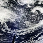 Hi-Res NASA image earlier today of "double barrel" low pressure system affecting us tonight & Sat. storm developing in central Pacific. (National Weather Service Seattle)