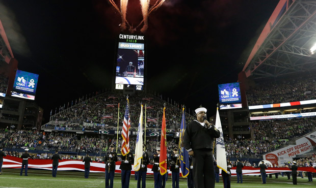 Retired U.S. Navy Petty Officer 1st Class Generald Wilson sings the national anthem at CenturyLink ...