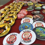 Check out all the buttons heads of a protest gathering steam at Seattle Central College on Friday. (Mike Lewis, KIRO Radio)