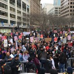 Crowds move through downtown Seattle on Friday for an anti-Trump rally. (Mike Lewis, KIRO Radio)