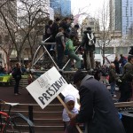 Protesters gather in Westlake on Friday to protest Trump's inauguration. (Mike Lewis, KIRO Radio)