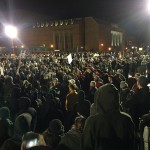 Protesters stand in Red Square Friday night while Milo Yiannopoulos speaks inside. (Josh Kerns, KIRO Radio)