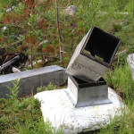 A damaged “obelisk” monument along the Washington/British Columbia border dates to the early 1900s. (Photo courtesy International Boundary Commission)