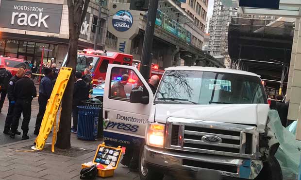 A vehicle crashed into a building at Fifth Avenue and Pine Street Thursday. (Seattle Fire)...