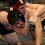 Beebo Russell, left, is seen here in 2007 wresting works against Chugiak's Sheldon Vogt during a 215 pound class consolation match in the 4A Alaska state wrestling championship in Chugiak, Alaska Saturday Dec. 15, 2007. (AP Photo/Al Grillo)