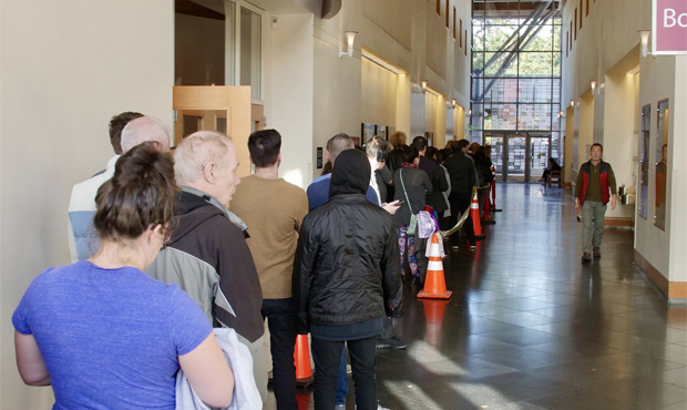 Voters line up in Bellevue to cast their ballots in person...
