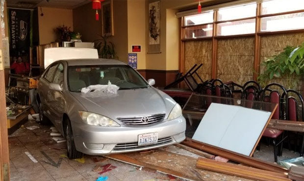Car drives through restaurant...