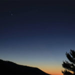 
              In this Sunday, Dec. 13, 2020 photo made available by NASA, Saturn, top, and Jupiter, below, are seen after sunset from Shenandoah National Park in Luray, Va. The two planets are drawing closer to each other in the sky as they head towards a "great conjunction" on Monday, Dec. 21, where the two giant planets will appear a tenth of a degree apart. (Bill Ingalls/NASA via AP)
            