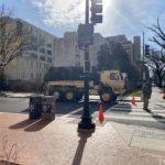 National Guard and other law enforcement stand on patrol. (Photo: Jason Rantz/KTTH)