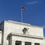 A flag flies above the Federal Reserve Board, near the National Mall. (Photo: Jason Rantz/KTTH)