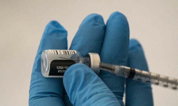 WENATCHEE, WA - JANUARY 26: A pharmacist prepares COVID-19 vaccines for patients arriving at Town T...