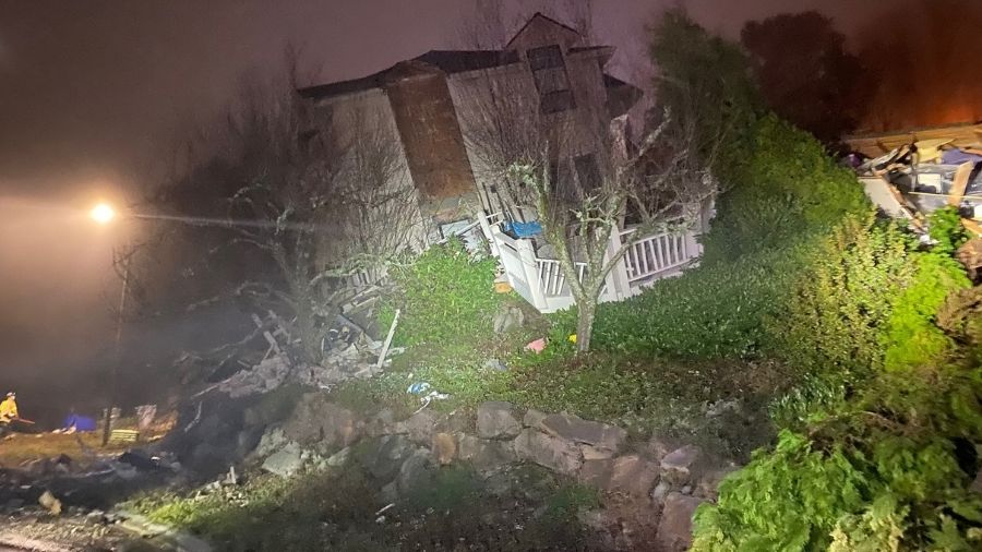 A home in Bellevue slid off its foundations and collapsed. (Photo courtesy of BellevuePD/Twitter)...