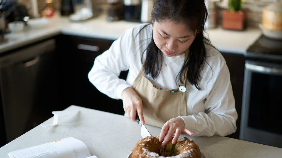 Kat Lieu bakes in her home kitchen. (Photo by Jake Young)...