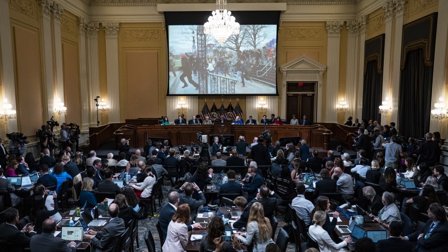 A video of rioters is shown on a screen in at a hearing held by the Select Committee to Investigate...