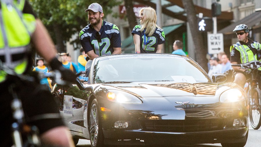 Actors Chris Pratt and Anna Faris ride in the Seafair Torchlight Parade Grand Marshal vehicle on Ju...