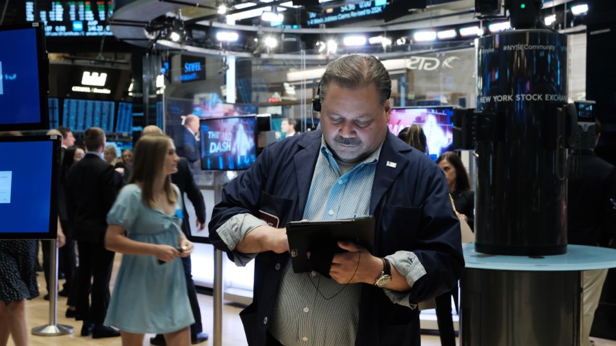 Traders work on the floor of the New York Stock Exchange (NYSE) on June 16, 2022 in New York City. ...