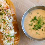 The crab roll dip sandwich features a Macrina Brioche split top bun with buttered Dungeness crab, lemon old bay aioli, celery and chives, and comes paired with a shrimp bisque.