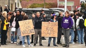 Photo: The rallygoers want school officials, community leaders and especially police to do more.