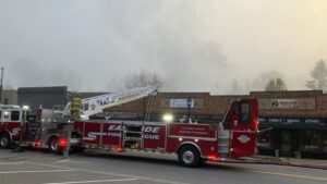 Photo: Eastside Fire crews examined the aftermath of a fire at a Snoqualmie business. 