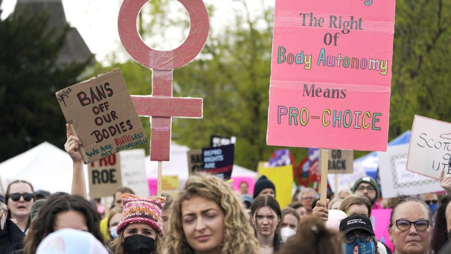 Photo: People hold signs and cheer during a protest and rally for abortion rights, Saturday, May 14...