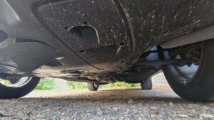 Photo: Damage under a victim's car as he ran over a large rock thrown from above onto I-90.