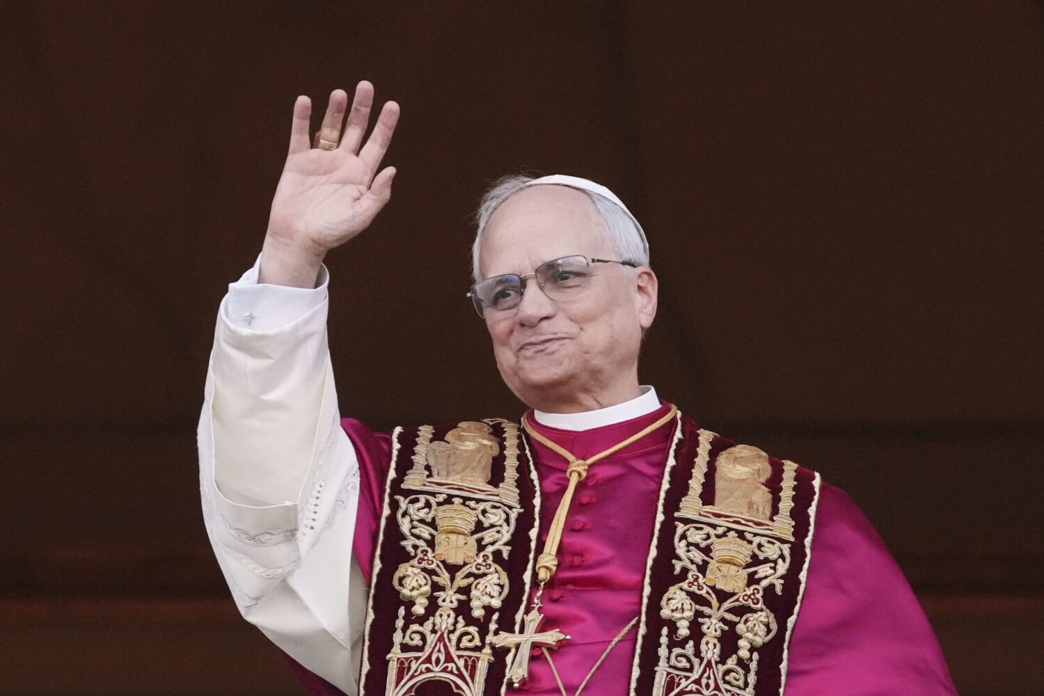 Pope Leo XIV appears on the central loggia of St. Peter's Basilica after being chosen the 267th pon...