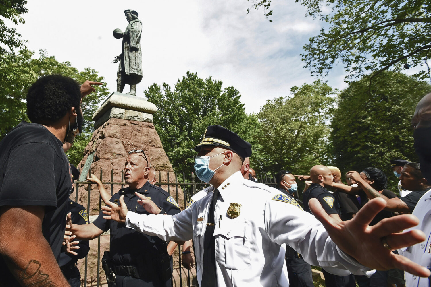 FILE - The statue of Christopher Columbus is removed from Wooster Square Park in New Haven, Conn., ...