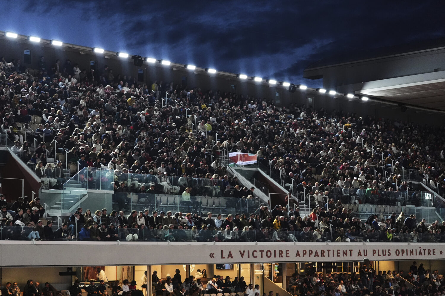 Fans watch on Court Philippe-Chatrier during a first-round match between Italy's Jannik Sinner and ...