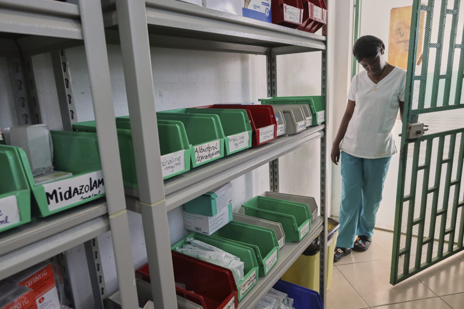 A nurse enters the medicine inventory room at New Hope Hospital in Plaine-du-Nord, Haiti, Wednesday...