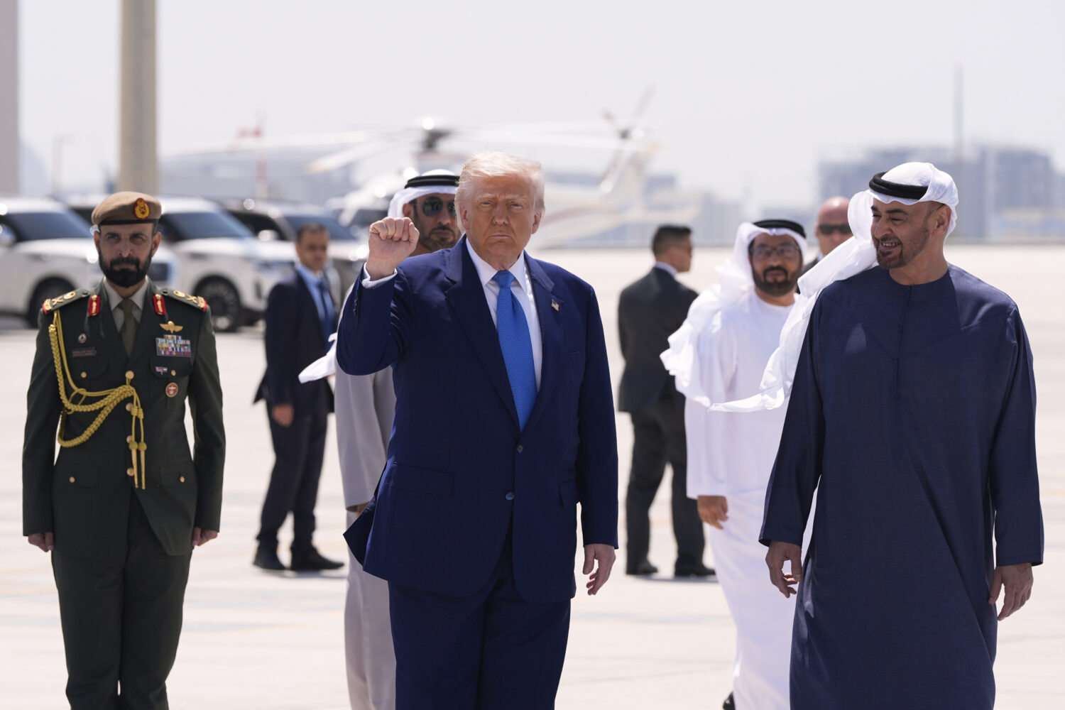 President Donald Trump gestures before departing on Air Force One at Abu Dhabi International Airpor...