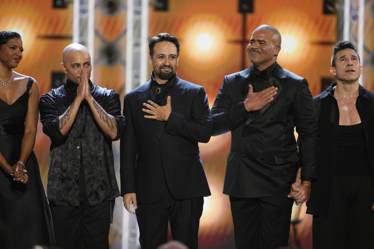 Renee Elise Goldsberry, from left, Lin-Manuel Miranda, and Christopher Jackson perform a medley fro...