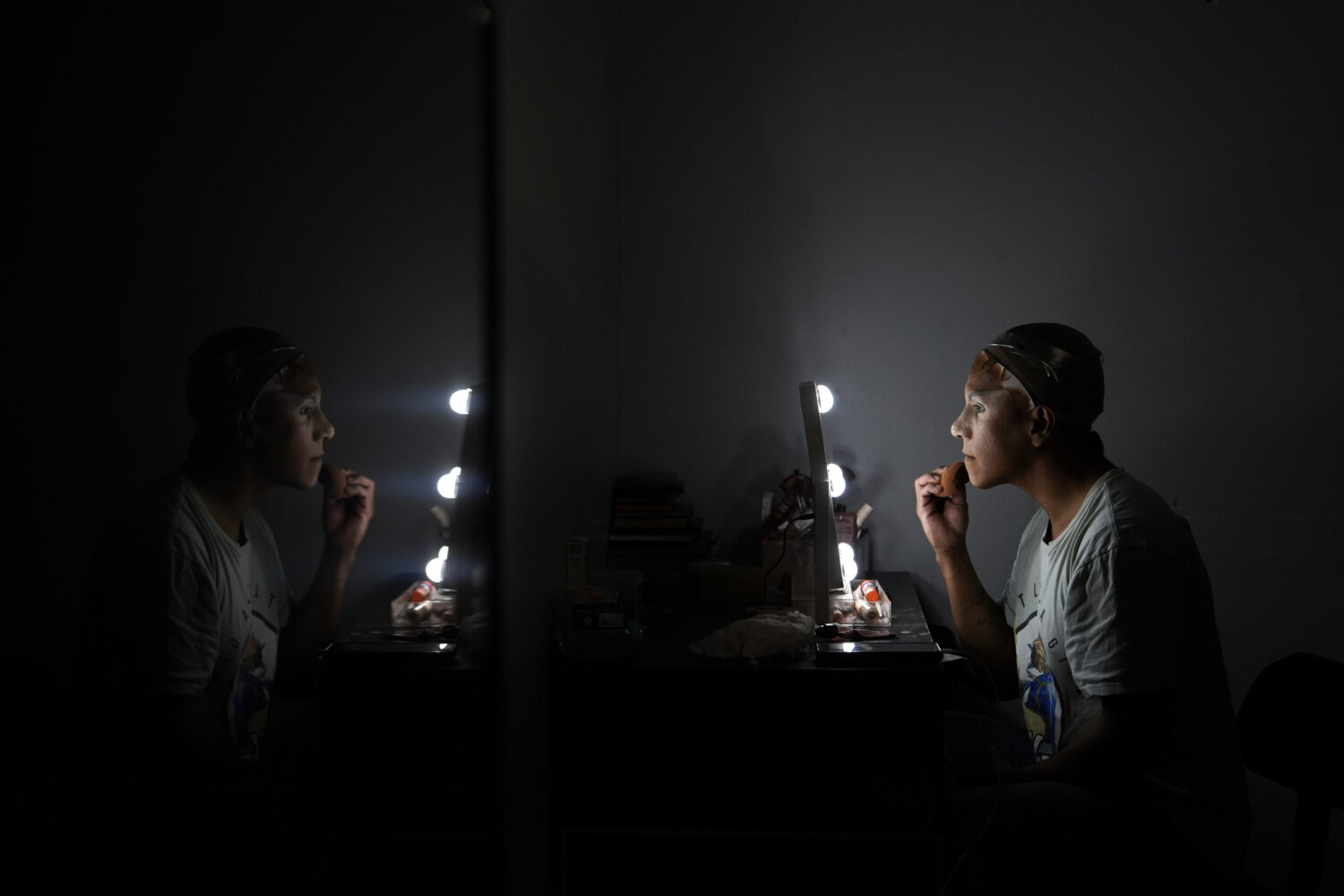 Mari Con Carne applies their makeup before attending Les Miserables at the Kennedy Center in drag, ...