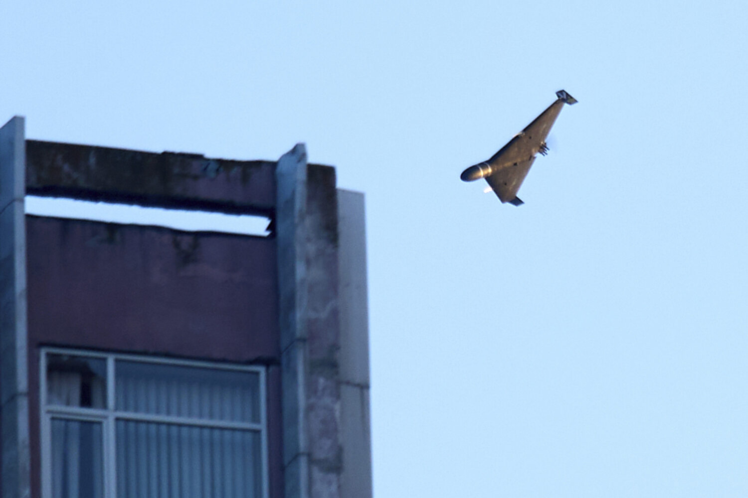 A Russian drone attacks a building during Russia's massive missile and drone air attack in Kyiv, Uk...