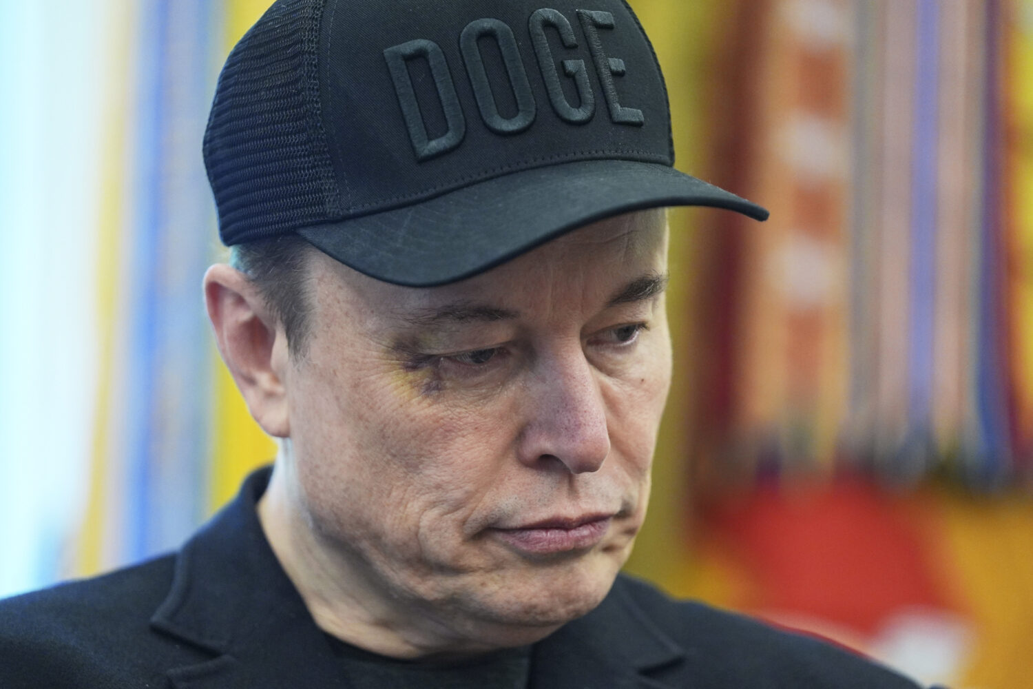 Elon Musk attends news conference with President Donald Trump in the Oval Office of the White House...
