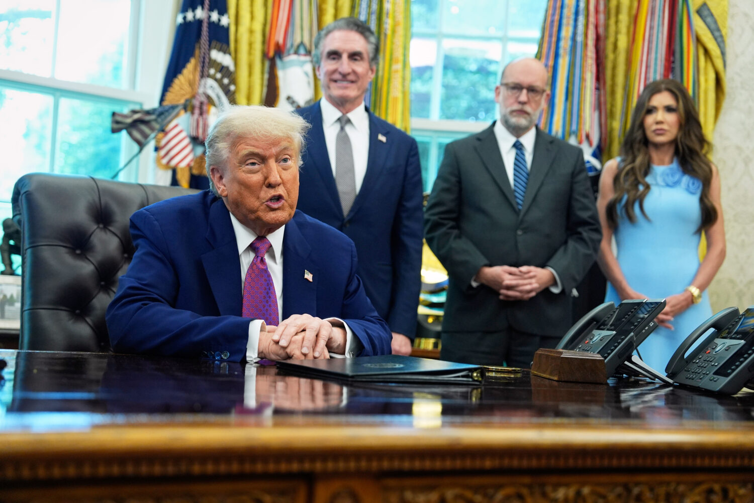 President Donald Trump speaks to the media in the Oval Office at the White House, Tuesday, June 10,...