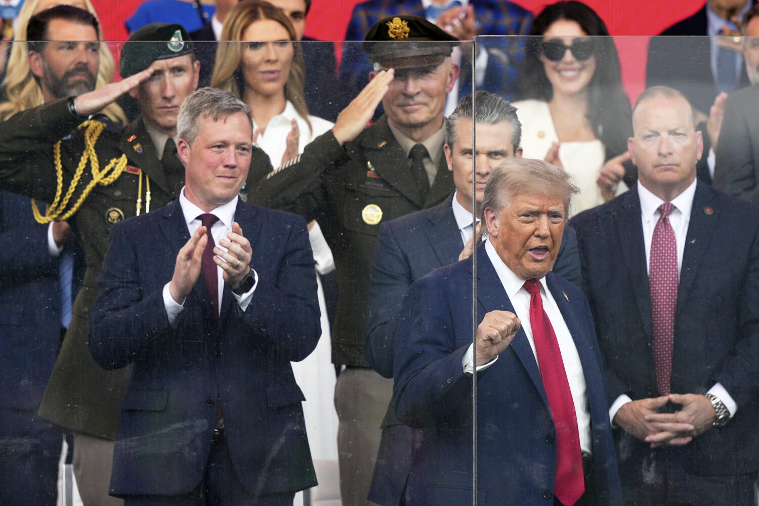 President Donald Trump arrives for a military parade commemorating the Army's 250th anniversary, co...