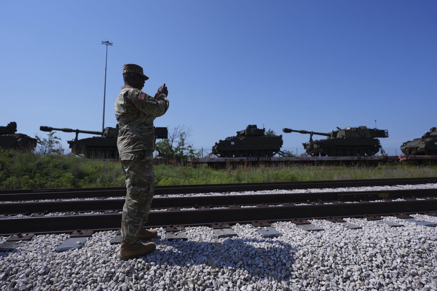 Tanks and other military vehicles are transported via railroad to Washington, D.C. for an upcoming ...