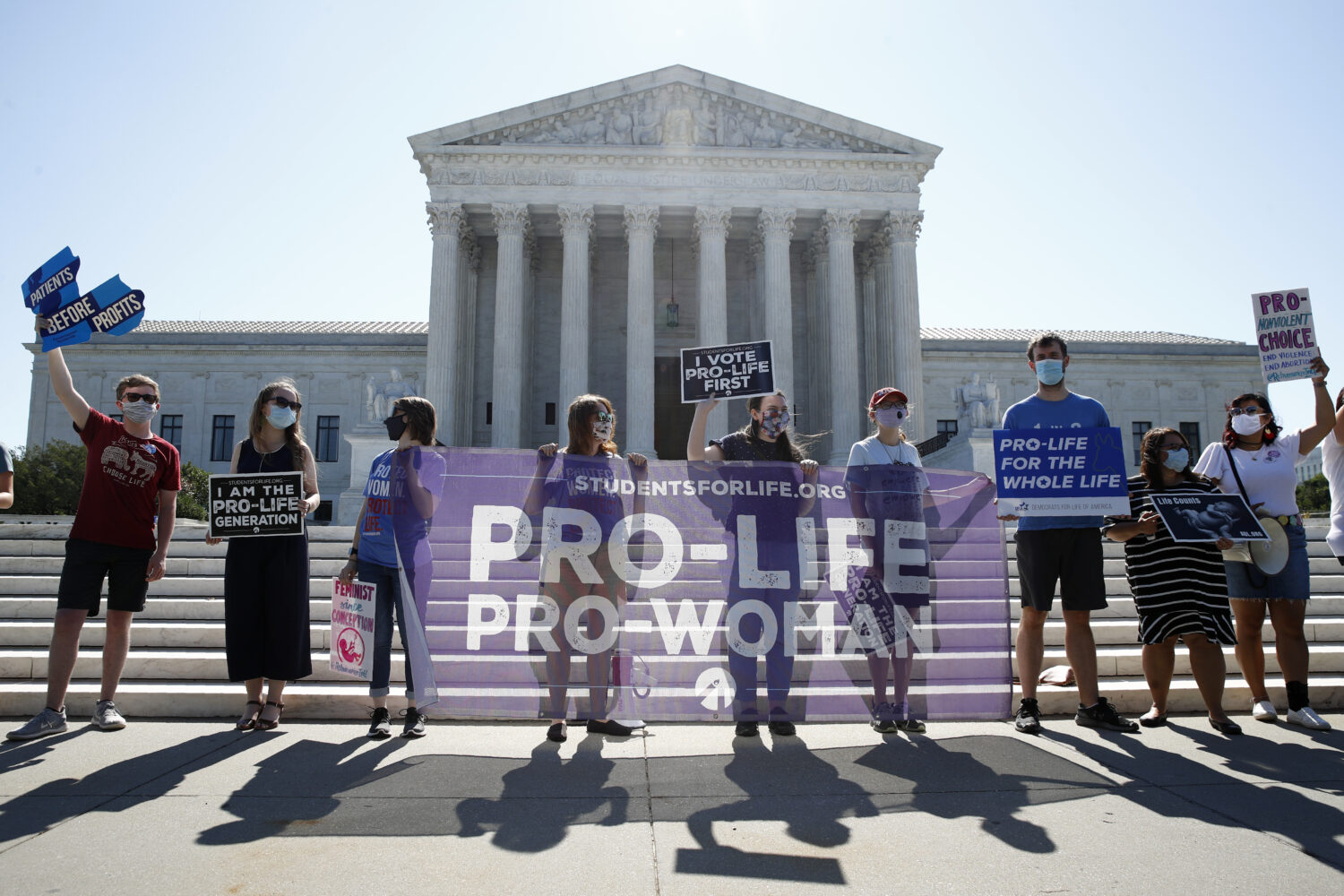FILE - In this June 29, 2020 file photo, Anti-abortion protesters wait outside the Supreme Court fo...