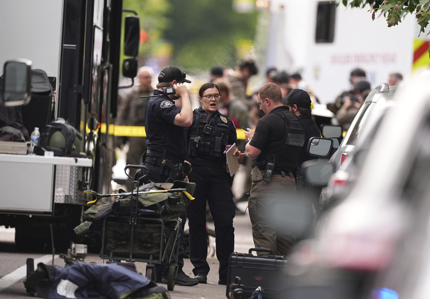 Law enforcement officials investigate after an attack on the Pearl Street Mall Sunday, June 1, 2025...