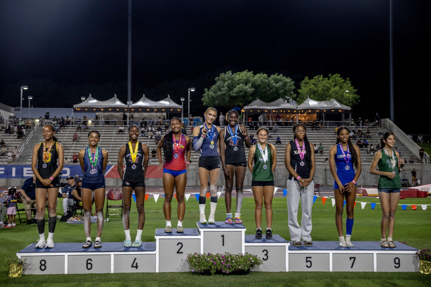 FILE - AB Hernandez, center left, shares the first-place spot on the podium with Kira Gant Hatcher ...