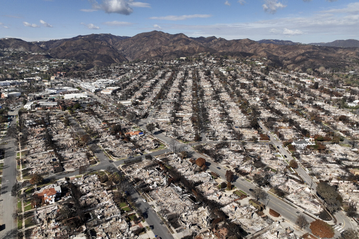 FILE - The devastation from the Palisades Fire is seen in an aerial view in the Pacific Palisades n...