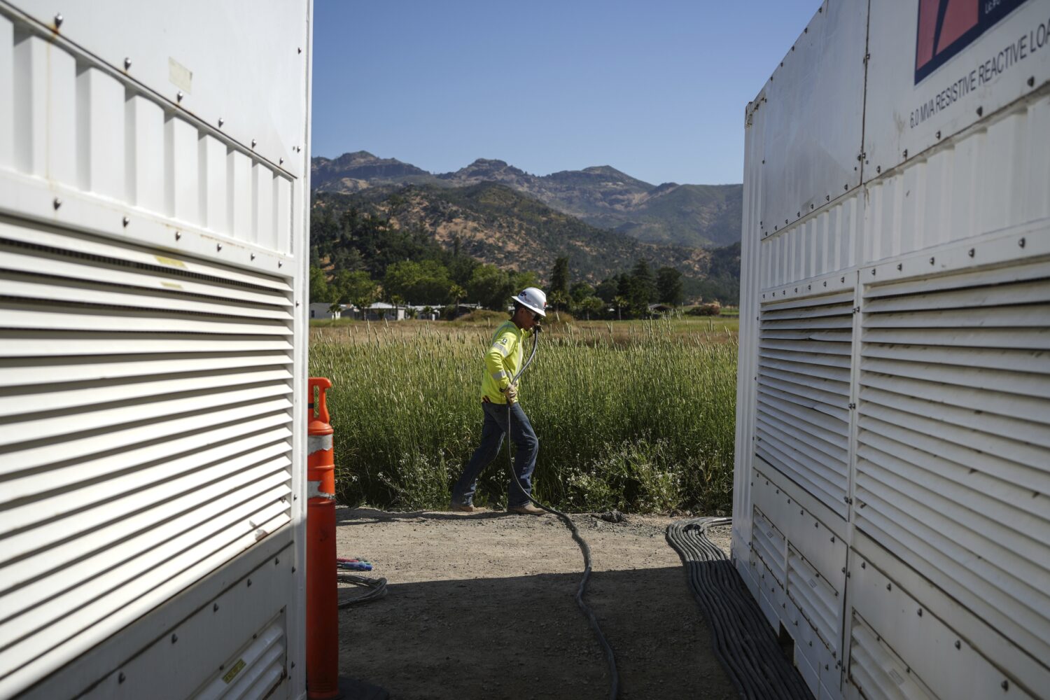 A worker lays cables at Energy Vault, a company that is creating an emergency power system that rel...