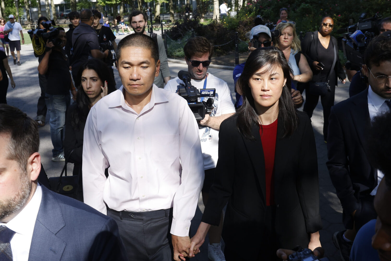 FILE - Former New York Governor Kathy Hochul aide Linda Sun, right, and her husband, Christopher Hu...