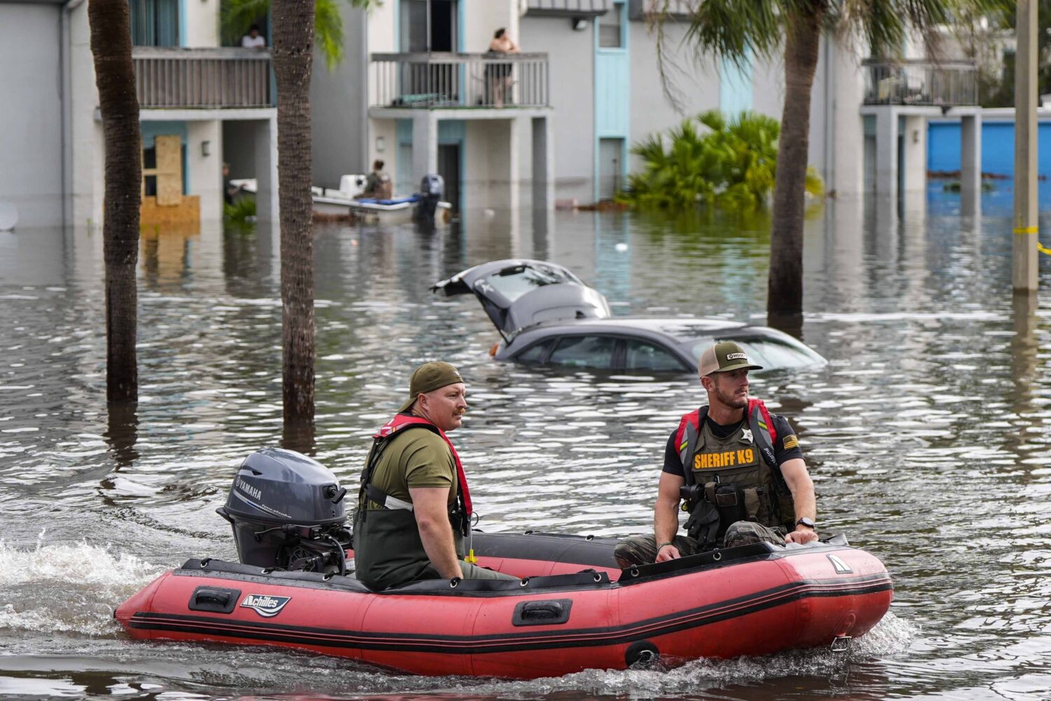 FILE - A water rescue boat moves in floodwaters at an apartment complex in the aftermath of Hurrica...
